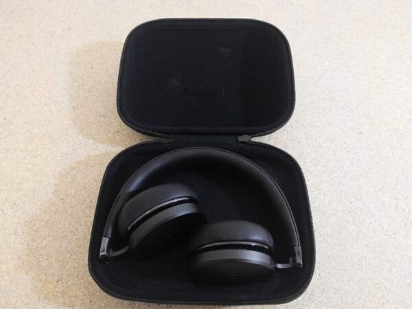 The FIIL CANVIIS Pro folded down and tucked into its open carrying case