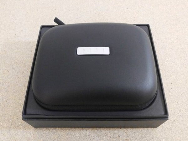 The FIIL CANVIIS Pro case viewed from directly overhead with its FIIL tag