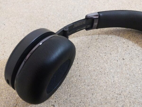 The FIIL CANVIIS Pro headband hinge mechanism with model information printed on the inner slider