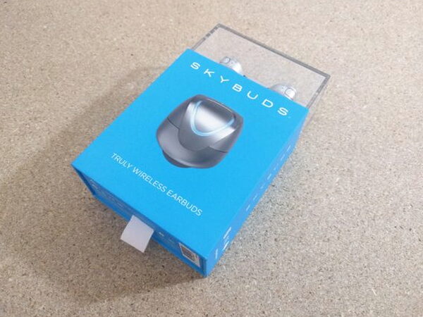 The Skybuds retail box with a clear display cube on top of the blue packaging