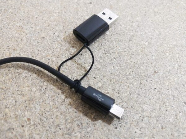 The FIIL CANVIIS Pro charging cable with Micro-USB on one end and a USB-A adapter on the other
