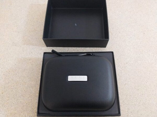 The FIIL CANVIIS Pro box opened, showing the zippered carrying case in the top tray