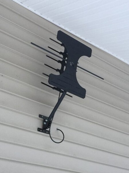 Winegard Elite 7550 mounted outside on siding
