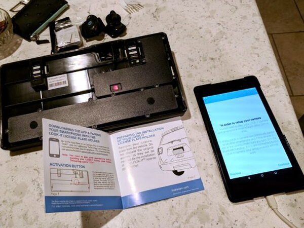 LOOK-IT app setup beside the manual and frame