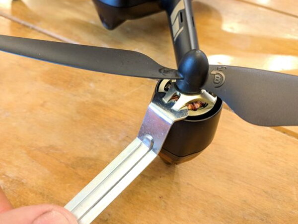 Prop wrench being used on Hubsan drone motor