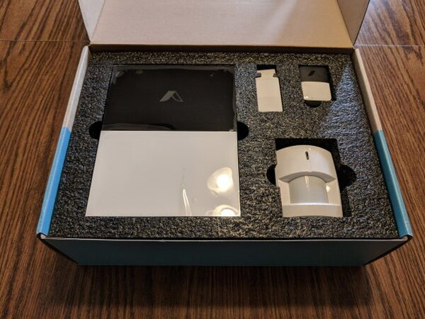 Open Abode box with gateway, sensor, and packaging foam