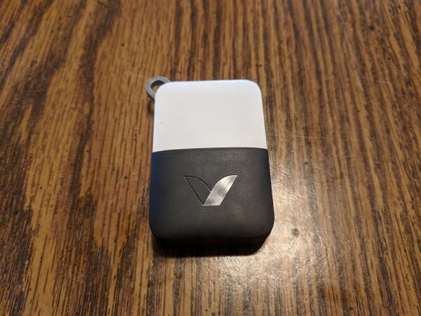 Abode Remote KeyFob on a table