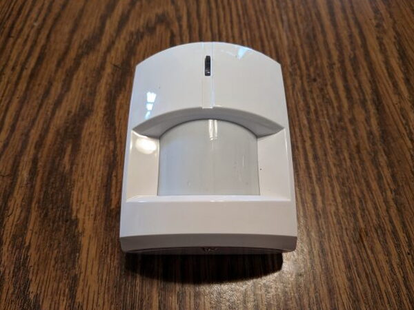 Abode Motion Sensor on a table
