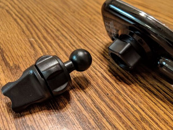 Vent mount ball joint next to the charging head