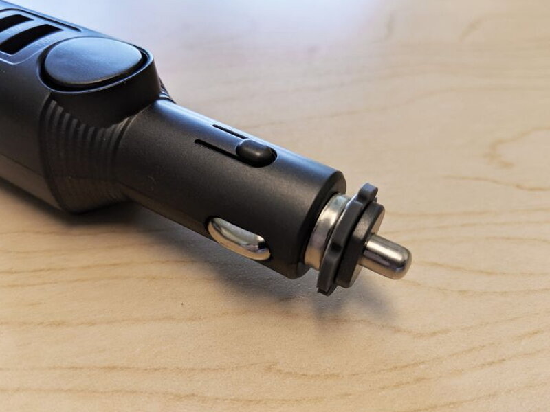 The metal cigarette lighter contact is the only substantial metal part on the alarm.