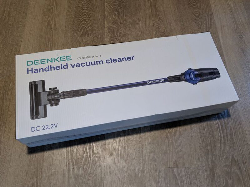 The plain white retail box shows the handheld vacuum cleaner on the front.
