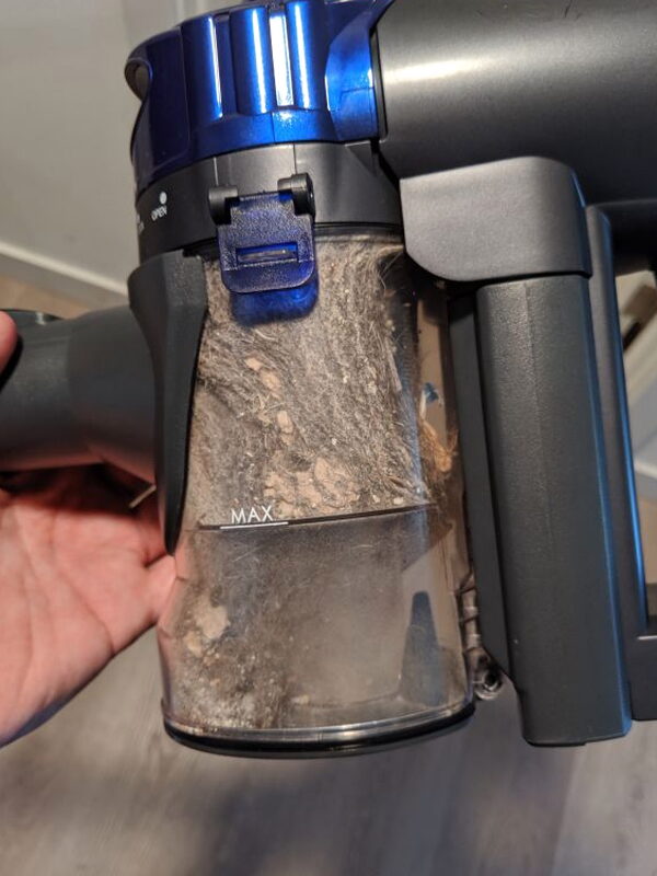 The dust container after a cleaning session collected more debris than expected.