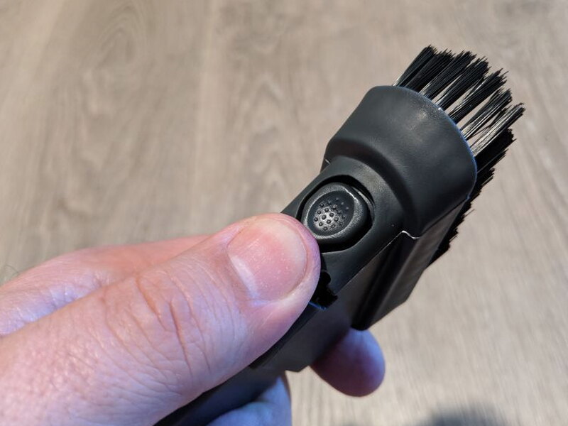 The round brush end on the 2-in-1 dusting attachment.