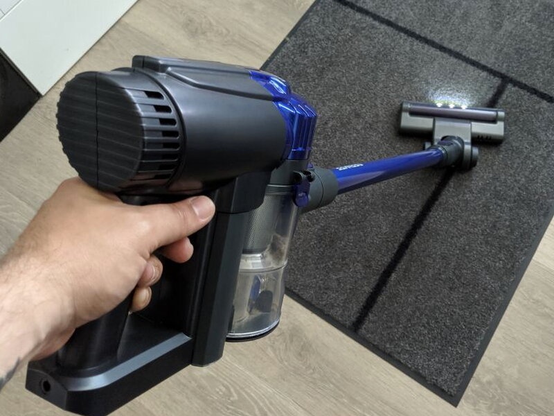 The DEENKEE being used as a handheld cleaner with the small attachment.