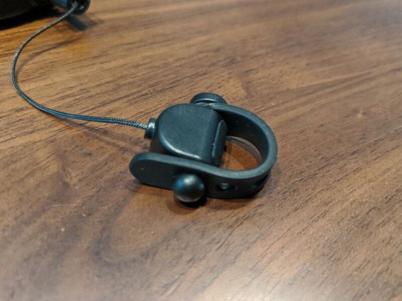 The soft rubber loop can be adjusted around VR headset cables.