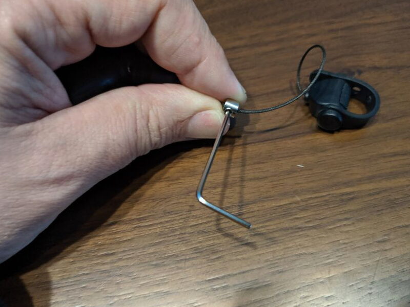 Using the included Allen wrench to loosen the adjustment nut.