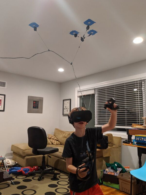 The V2 system keeping the headset cable above an active Minecraft session.
