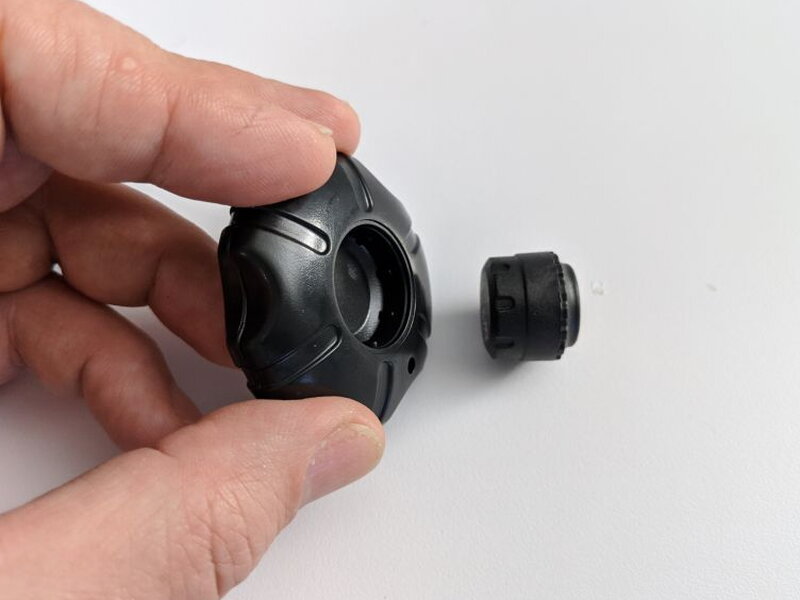 The included round tool opens the tire sensor so the battery compartment can be reached.