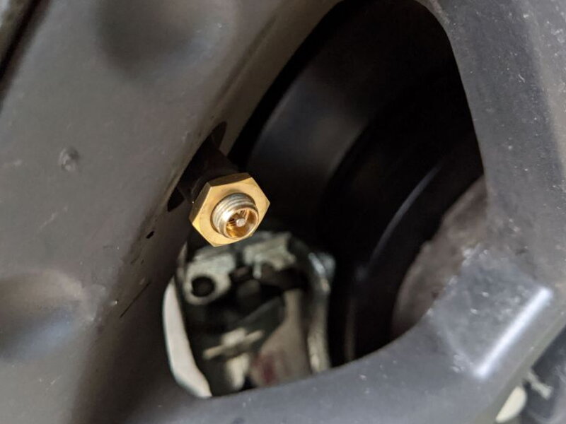 The first step is threading the hex nut onto the valve stem.