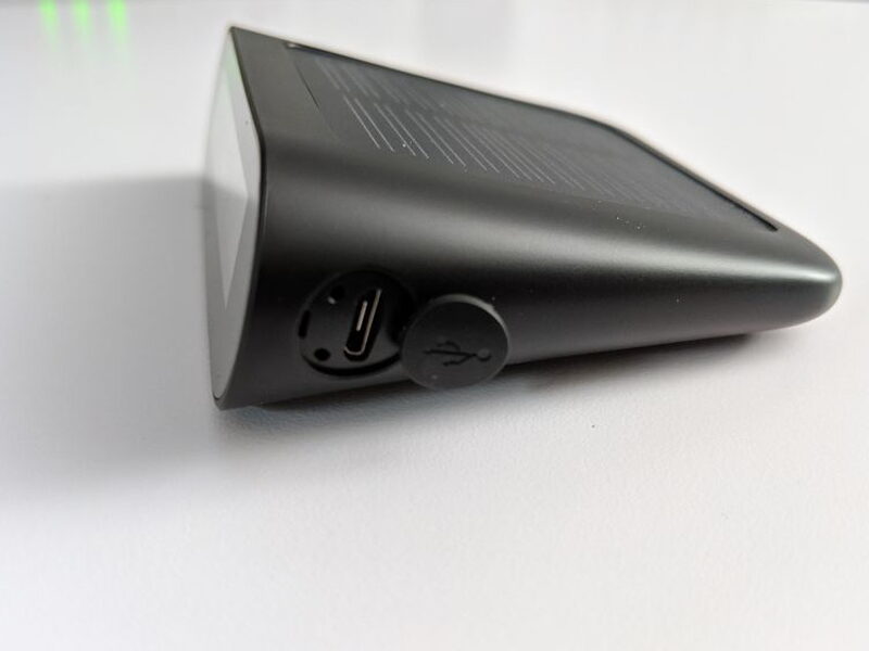A Micro USB port on the side handles the initial charge or backup charging.