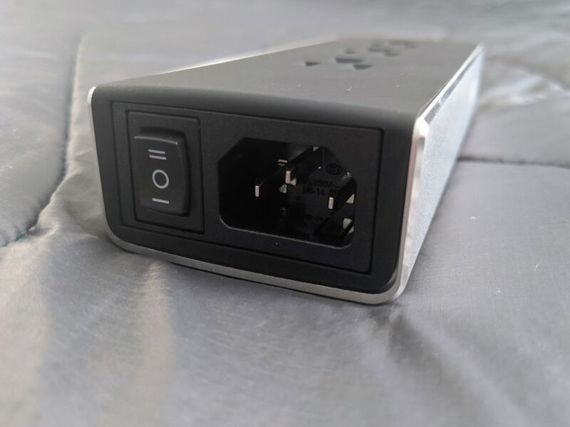 The end panel includes the power switch and standard three prong power inlet.