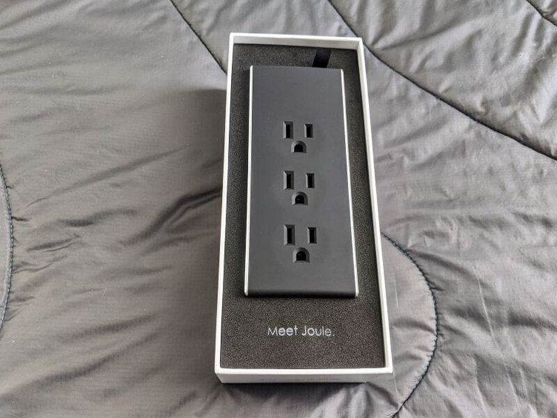 The JouleBAR sits neatly inside the box with the outlets facing up.