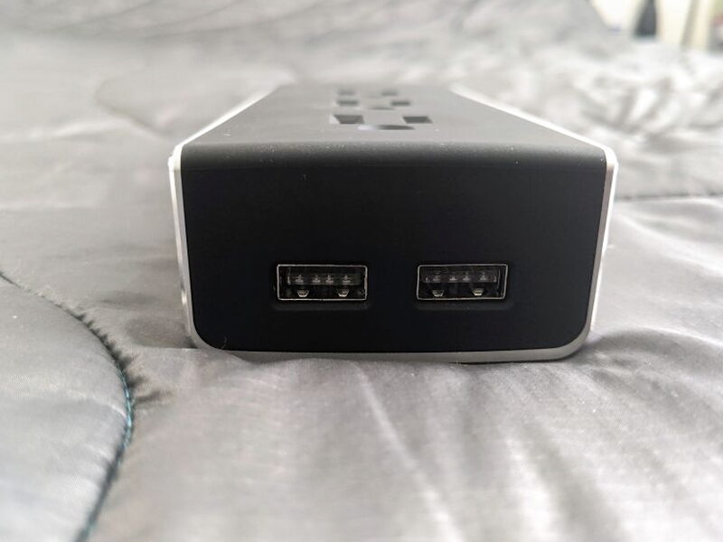 Two USB ports sit together on the far end of the power strip.