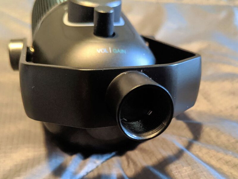 The swivel stand’s locking knob and threaded mount, seen from the side.