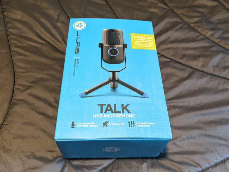 The retail box, blue with the feature list printed on front.