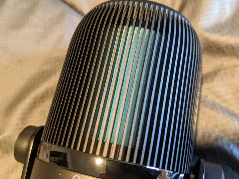 The metal fin grille up close, aluminum over the top dome.