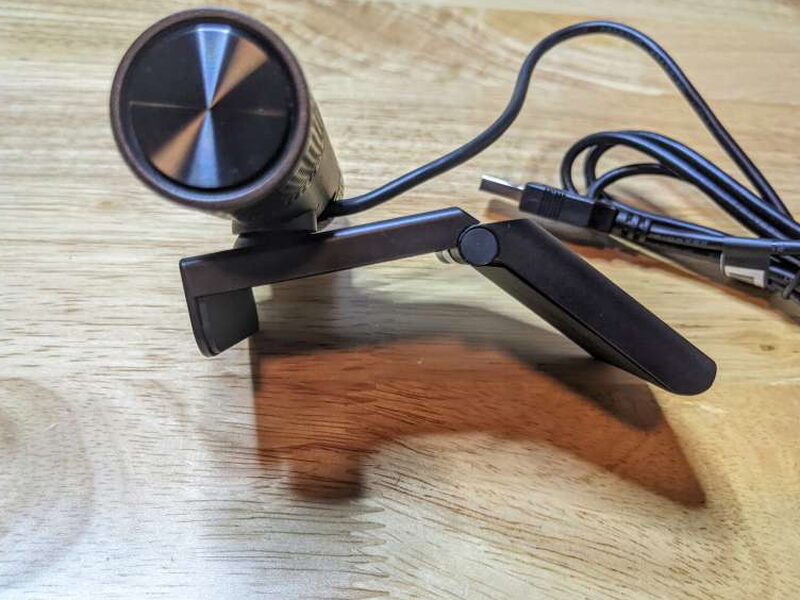 The folding clip opens wide enough to grip a monitor or laptop display.