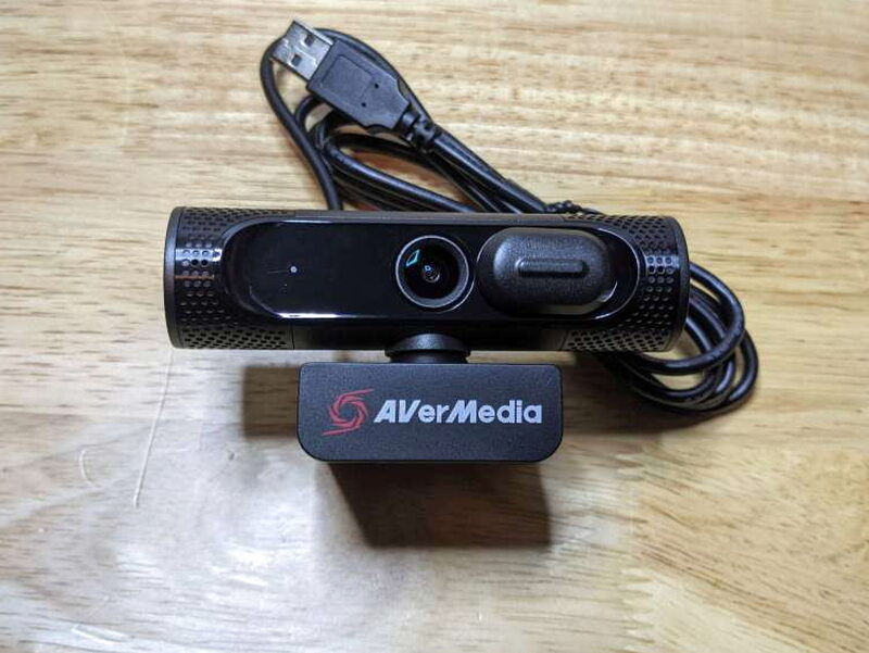 The PW315 has a broad body, a built-in clip, and an attached USB-A cable.