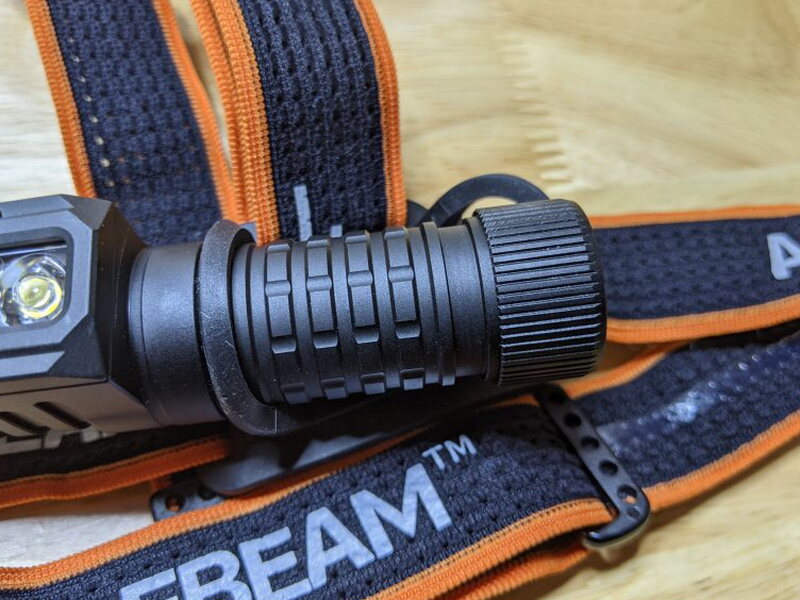 The PT40 body fits through the round silicone loops on the headband mount.