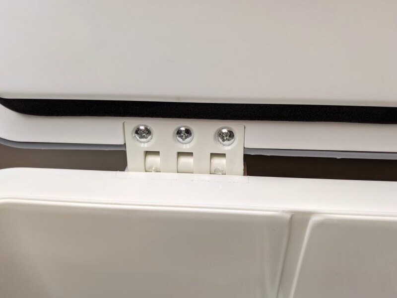 Interior hinge sockets after the lid has been attached.