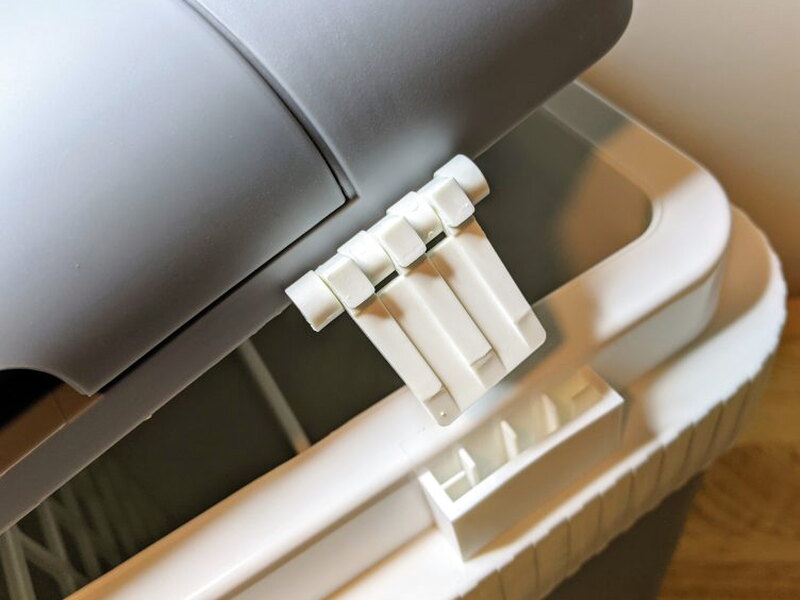 Lid hinge tabs aligned with the slots on the cooler body.