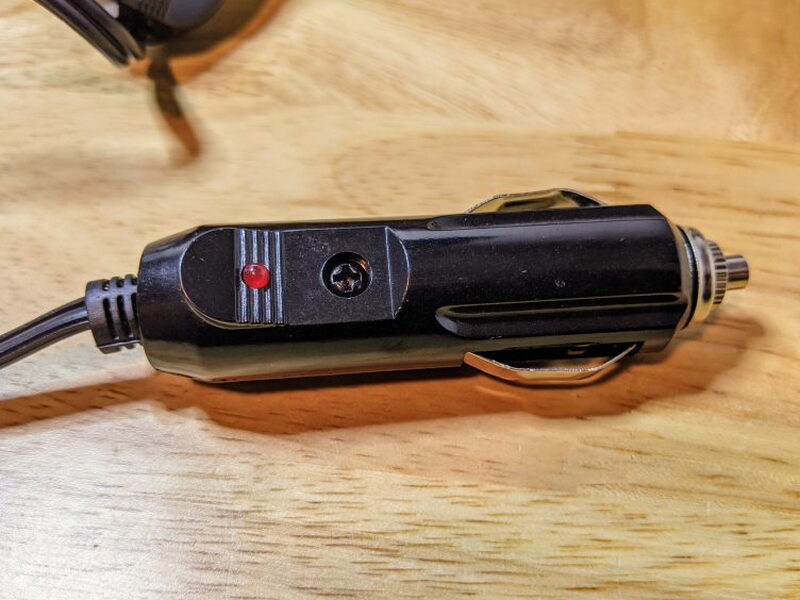 12V plug with red switch, indicator light, and replaceable fuse.