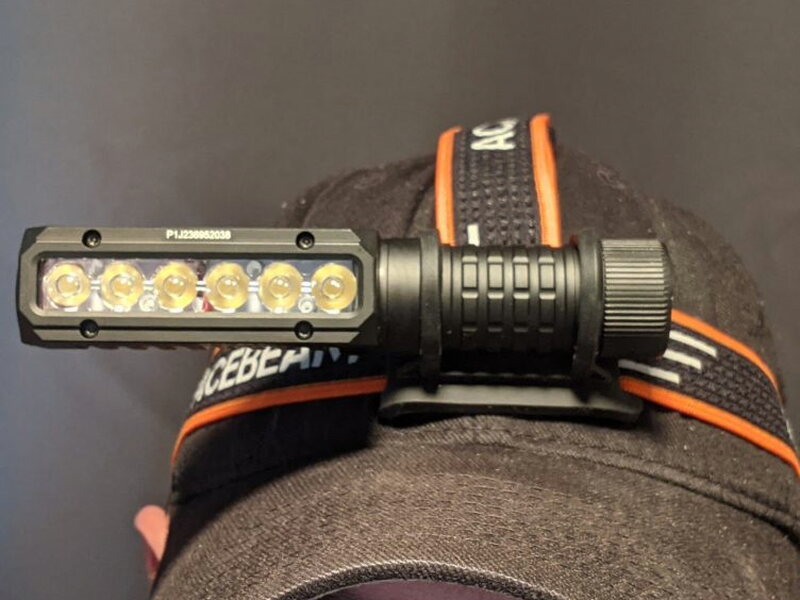 The PT40 worn as a headlamp, showing the off center right angle body.