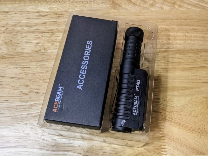 The PT40 and accessory box are secured inside the molded packaging.