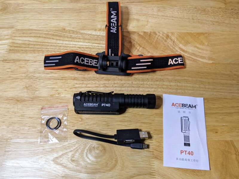 The full PT40 kit includes the light, headband, cable, spare O-rings, and manual.