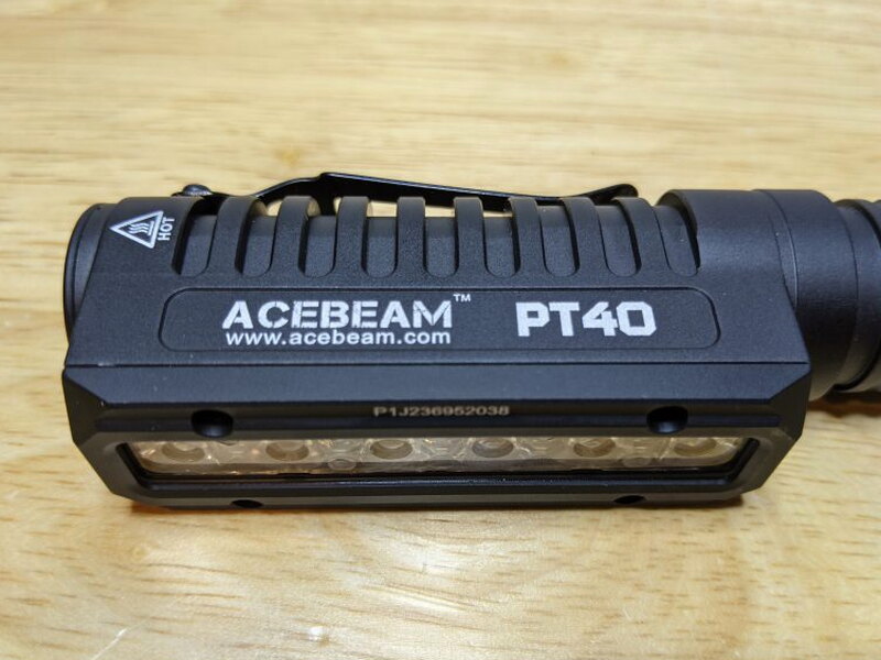 The front of the PT40 shows the Acebeam branding and the long LED window.
