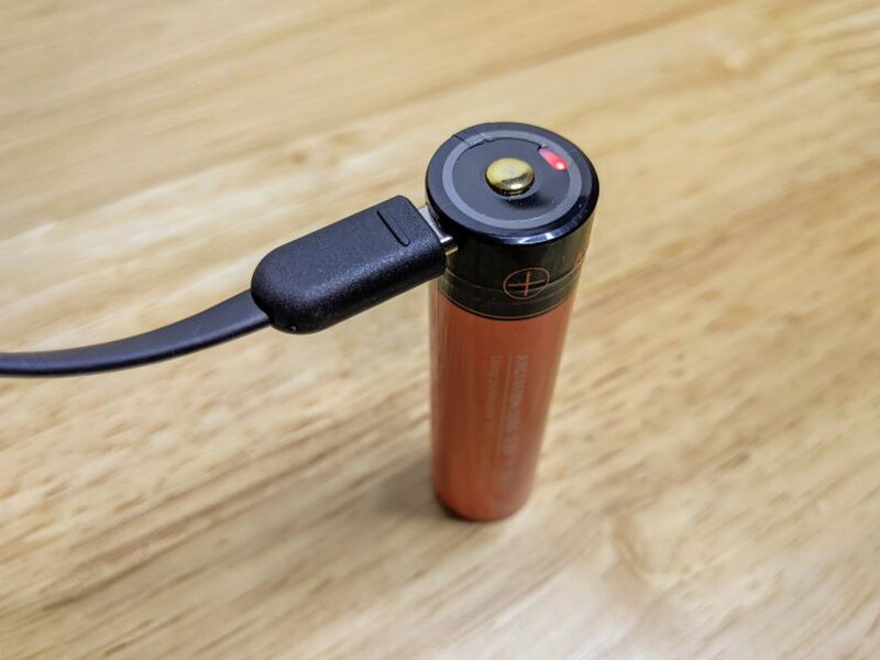 The battery indicator glows while the cell is charging.