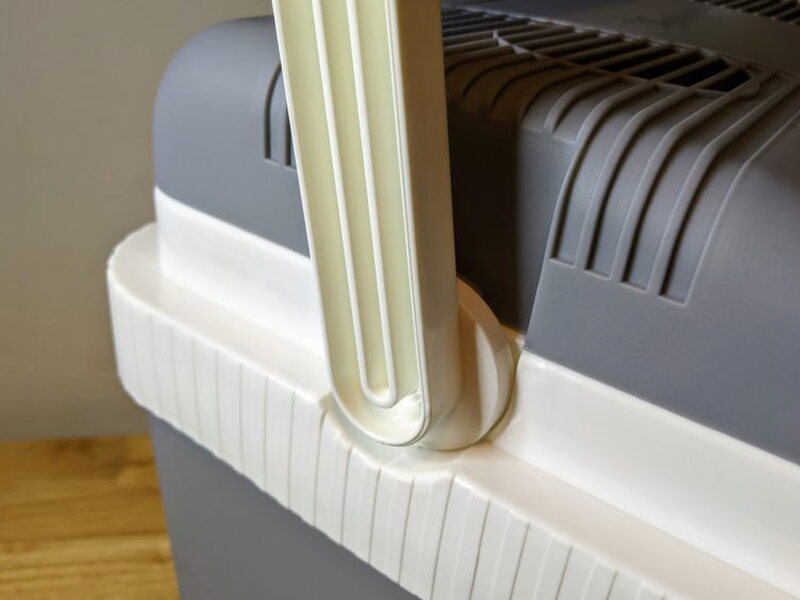 Handle position at the side of the cooler body.