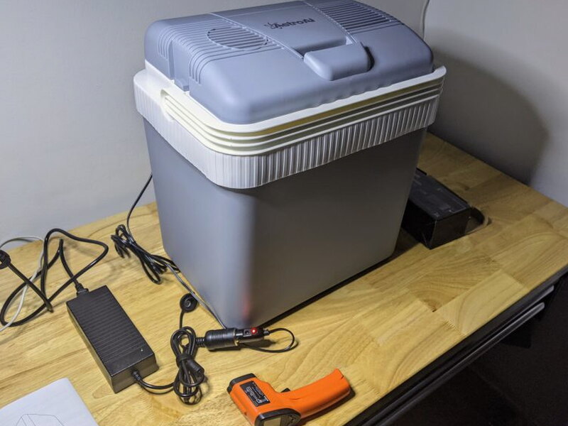 Test setup with cooler, converter, thermometer, and timer.