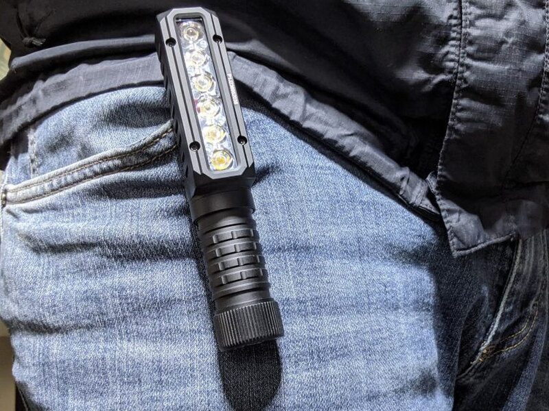 The PT40 clipped to a pants pocket with the LED head facing outward.