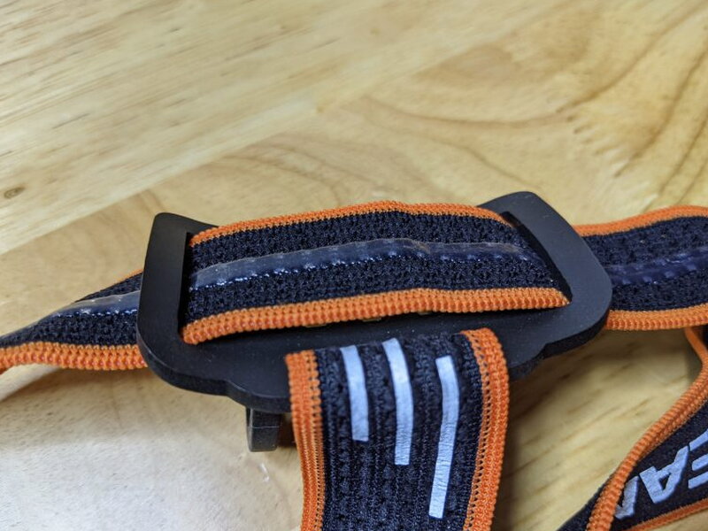 The back side of the headband mount shows the silicone edges that contact the forehead.