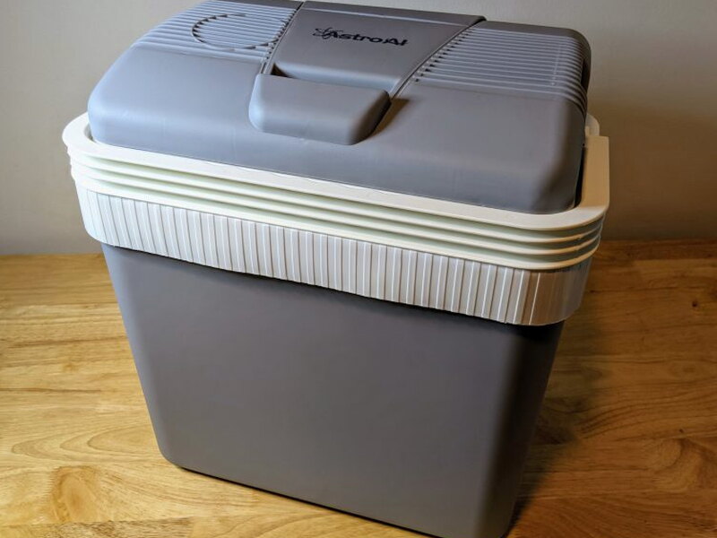 Cooler standing closed with the handle down.