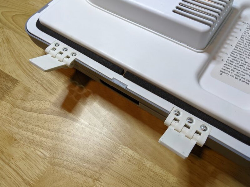 Close look at the hinge tabs before installing the lid.