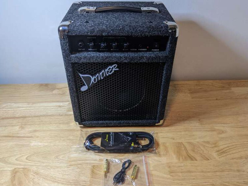 The DBA-1 package includes the amp, audio cable, adaptors, and instrument cable.