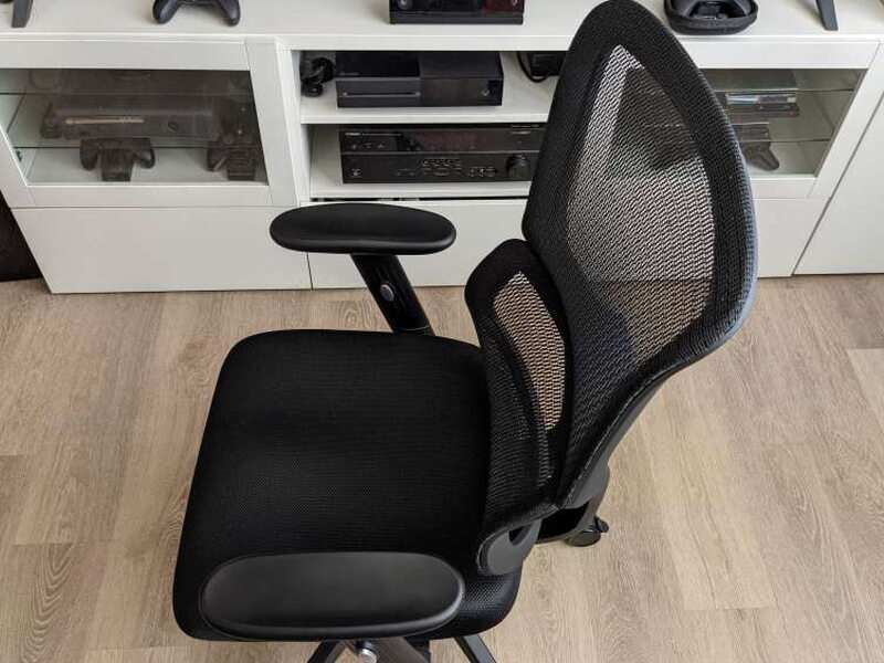 Backrest attached, headrest not yet on, its bare mounting slot visible at the top.