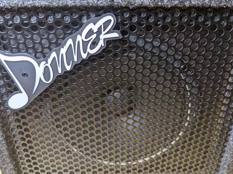 The metal front grille protects the 6.5 inch hybrid cone speaker.